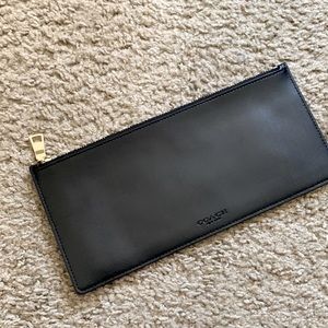 Coach leather sleeve